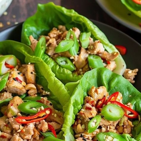 Recipes Mentor on Instagram: "🌶️ Healthy Asian Spicy Chicken Lettuce Wraps 🌿
​
📋 Ingredients:
​
Chicken Mixture:
🍗 1 lb Ground chicken
🌶️ 1/4 cup Red Bell pepper, diced
🧅 1/4 cup Onion, diced
🌶️ 1 tbsp Jalapeno, diced
🧄 2 cloves Garlic, chopped
🫚 1 tbsp Ginger, grated or chopped
🌱 1 stalk Green onion, only the green part
🌿 1 handful Cilantro, chopped
Sauce Mixture:
🌶️ 2 tbsp Soy Sauce (or Tamari or Coconut aminos)
🥢 1 tbsp Hoisin Sauce
🍯 1 tbsp Honey
🌶️ 1 tsp Sriracha sauce
🍚 1 tsp Rice Wine Vinegar
Optional Toppings for Serving:
🥬 Lettuce leaves
🥕 Carrots, shredded
🥒 Cucumber, sliced
🥜 Peanuts, chopped
​
📝 Instructions:
​
1️⃣ First, dice the onion, garlic, green onions, red pepper, jalapeno, and cilantro. 🌶️🧄🧅
2️⃣ Heat sesame oil in a large skillet or wok over medi Chicken Lettuce Wraps, Sriracha Sauce, Sandwiches For Lunch, Ground Chicken, Shredded Carrot, Lettuce Wraps, Hoisin Sauce, Chinese Cooking, Spicy Chicken