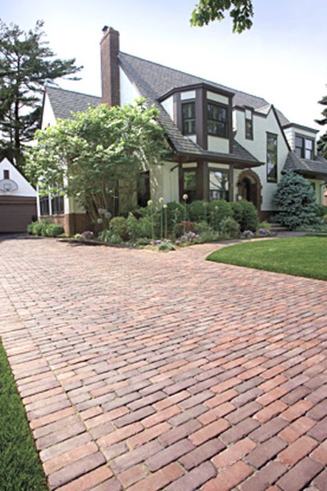 Brick patios, walks and brick driveways are among of the easiest-to-build home projects. Also, outdoor walkways and paths make your yard more inviting, increase your home's value, and make large yards easier to navigate. Brick driveway paving stones can be obtained in a wide variety of shapes, colors, and textures. This material is usually very durable when a sealer is applied to the surface. Driveway Paving Stones, Brick Paths, Brick Paver Driveway, House Lighting Outdoor, Brick Driveway, Driveway Paving, Brick Path, Brick Walkway, Outdoor Walkway