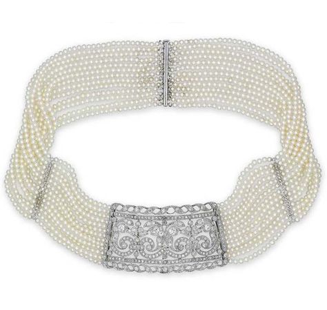 A DIAMOND AND SEED PEARL CHOKER. The central pierced panel millegrain-set with circular rose-cut and old European-cut diamonds in foliate design, to the thirteen-row seed pearl necklace with similarly-cut diamond spacer panels and clasp, mounted in white gold, 33.0 cm long Antique Choker, Journey Pendant, Jeweled Shoes, Pearl Jewels, Pearl And Diamond Necklace, Vintage Fine Jewelry, Royal Jewels, Seed Pearl, Necklace Choker