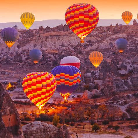 Cappadocia is one of the most beautiful and most photographed locations in Turkey. With a terrain that’s characterized by the famous fairy chimneys and a sky that’s dotted with hot air balloons, Cappadocia offers visitors accommodations that are just as whimsical as you might think. The cave suites in Cappadocia are luxurious and romantic accommodations that are carved out of the landscape. This allows you to truly appreciate the natural beauty around you. Fly Over, Cappadocia Balloon, Hot Air Balloon Festival, Cappadocia Turkey, Over The, Hot Air Balloon Rides, Air Balloon Rides, Hot Air Balloons, Acropolis