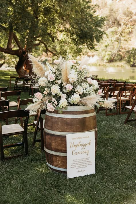 Wedding Flowers On Whiskey Barrels, Wine Barrel Floral Arrangement Wedding, Wedding Florals With Pampas, Rustic Pampas Wedding Decor, Pampas Grass Whiskey Barrel, Boho Barrel Flowers, Pampas Grass Barrel Arrangement, Barrel Floral Arrangements Wedding, Pampas Grass Wedding Flowers