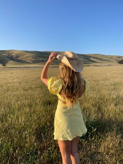 cowboy hat, yellow dress, country lifestyle, country girl, rolling hills, puff sleeves, country, cowgirl, cowgirl hat, western, fashion, mini dress, prarie aesthetic Yeehaw Aesthetic, Yellow Rose Of Texas, Country Aesthetic, Texas Girl, Cowgirl Aesthetic, Country Concert Outfit, Country Concert, Inspo Pics, Coastal Cowgirl