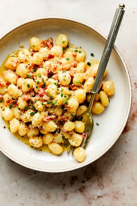 This Gnocchi Carbonara recipe gives the iconic Italian pasta dish an extra-cozy twist! Simply toss pillowy-soft potato gnocchi dumplings with rendered pancetta & a foolproof carbonara sauce, which is made with cheese & egg yolks to eliminate the risk of scrambling & create an extra rich, perfectly silky sauce. The result is a quick & cozy carbonara dinner, ready in 20 minutes or less! #carbonararecipes #carbonarasauce #gnocchirecipes #gnocchidishes #italianrecipes #easydinnerideas #dinnerideas Gnocchi Pancetta Recipes, Carbonara Gnocchi, Gnocchi Carbonara, How To Make Carbonara, Carbonara Ingredients, Gnocchi Dishes, Gluten Free Gnocchi, Carbonara Sauce, Making Gnocchi