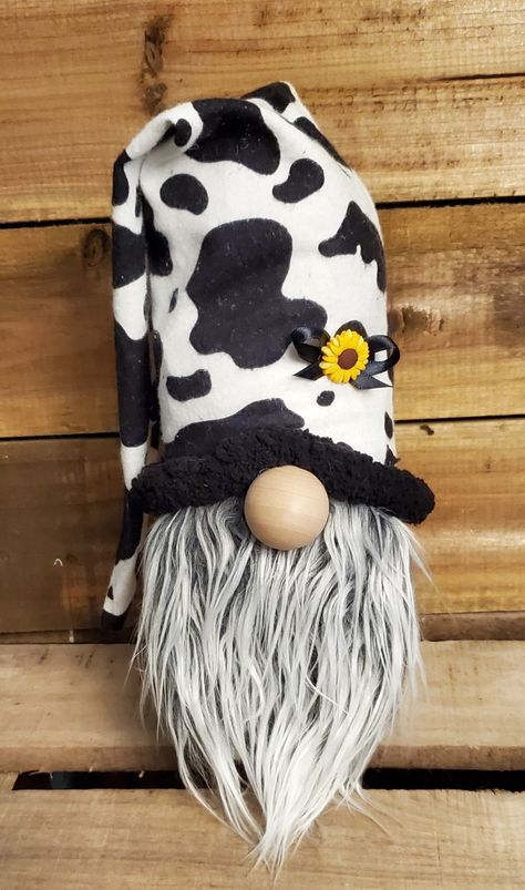 This cute little guy is dressed in cow print and loves sunflowers. He, and other gnomes, are on my Facebook page called All My Gnomies if you are interested. Thank you! Cow Gnomes, Cow Gnome, Gnome Village, Country Stuff, Gnomes Crafts, Cow Print, Facebook Page, Cow, Paintings