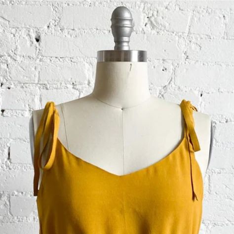 True Bias on Instagram: "The Ogden Cami is very hackable. Search “Ogden Hack” on our site and tons of options pop up. This sweet little blouse is one of my favs. Through the blog post (linkinbio) we teach you how to add tie straps and a cropped elastic waistline to this staple pattern.⁠
#ogdencami #ogdencamihack" Ogden Cami, Sewing Tops, Pop Up, Blog Post, Street Style, Elastic, Sewing, Pattern, Instagram