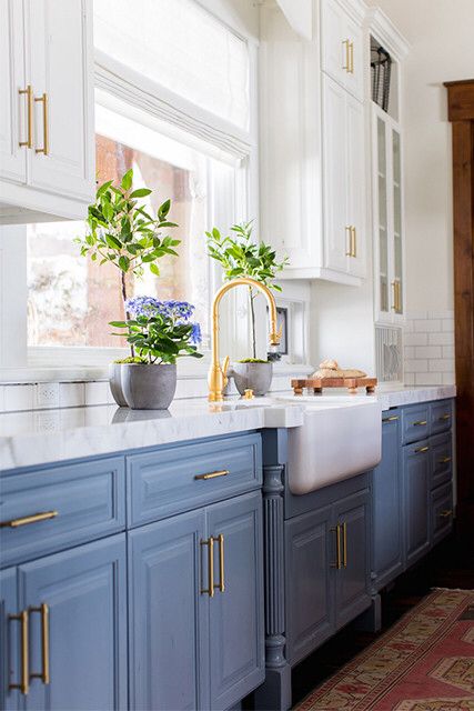 Let them bake cake! In this kitchen the soft, blue cabinets and warm metallic fixtures would make Marie Antoinette proud. Bright white upper cabinets accent the blue, keeping it current and classic all at the same time. Kitchen With Blue Cabinets, Blue Kitchen Designs, Green Kitchens, Cabinet Inspiration, Kitchen Ikea, Blue Kitchen Cabinets, Farmhouse Kitchens, House Updates, Farmhouse Kitchen Cabinets