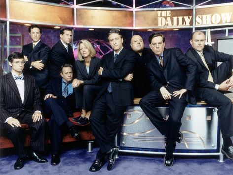 "The Daily Show" season seven promo still, 2002.  L to R: Mo Rocca, Stephen Colbert, Lewis Black, Steve Carell, Nancy Walls, Jon Stewart, Frank DeCaro, Ed Helms, Rob Corddry. Ed Helms, Avengers Theme, Jon Stewart, Steve Carell, The Daily Show, Stephen Colbert, Sometimes I Wonder, Song Play, Comedy Show