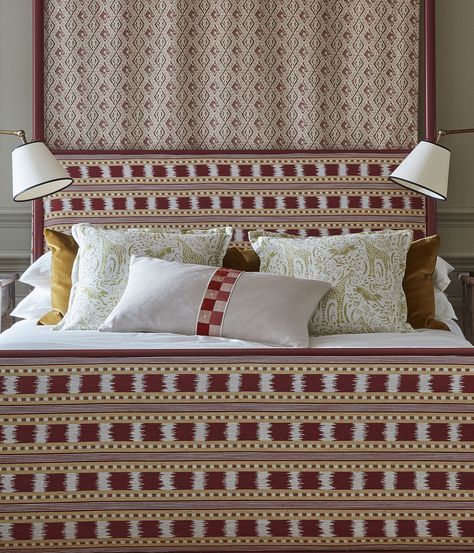 Upholstered bed frame in red and gold Ikat stripes. Cushions are centred on the bed. Bedside lamp on either side of bed. Ikat Headboard, Ikat Stripe, Fabric Combinations, Curtains Blinds, Simple Colors, Giraffes, Fun Design, Headboards, Colour Palette