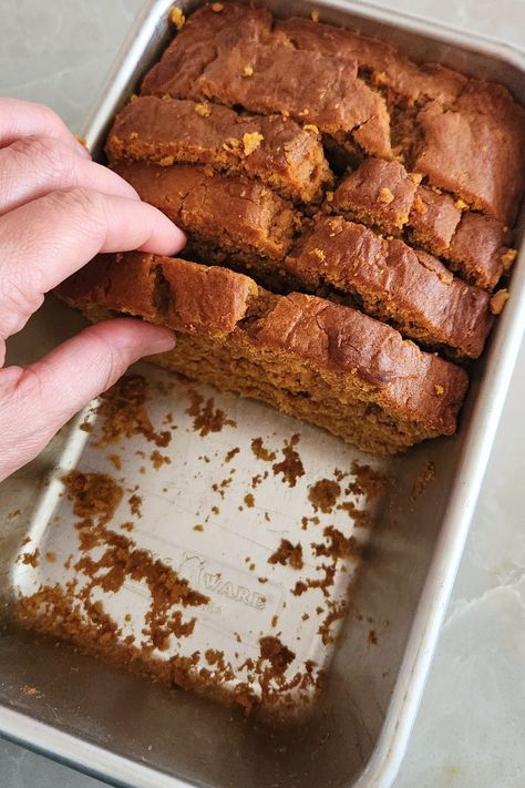 woman's hand grabbing a slice of sourdough pumpkin bread Sourdough Banana Pumpkin Muffins, Pumpkin Sourdough Discard Bread, Sour Dough Pumpkin Bread, Einkorn Pumpkin Bread, Discard Pumpkin Bread, Thm Sourdough Recipes, Sourdough Discard Pumpkin Bread, Pumpkin Sourdough Recipes, Pumpkin Sourdough Bread