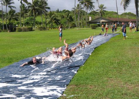 Giant Slip-n-Slide.  Did something similar for an end-of-year baseball party - on a hill, with a small ramp at the bottom that dumped you into a kiddie pool. *Totally* worth the dead grass path it left! We used extra-wide/heavy plastic from a concrete place;  a little dish soap to help with the "slip" Tarp Slip N Slide, Adult Slip And Slide Party, Slip And Slide Party, Yard Games For Adults, Giant Slip And Slide, Grass Path, Slip N Slide, Olympic Party, Games For Adults