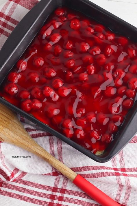 Pour cherry pie filling on top of dough for cherry squares Cherries In The Snow Recipe, Snow Dessert, Easy Cherry Pie, Cherries In The Snow, Snow Recipe, Cherry Pie Bars, Fruit Pie Filling, White Chocolate Shavings, Cherry Topping