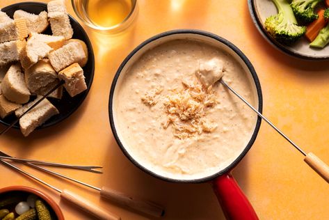 This lightly spiced hot crab fondue recipe is flavored with garlic, shallots, wine, cream cheese, Cheddar, and Worcestershire sauce. Crab Fondue, Champagne Chicken, Chicken Liver Mousse, English Cheese, Veal Stew, Fondue Recipe, New Years Eve Dinner, Molten Lava Cakes, Fondue Recipes