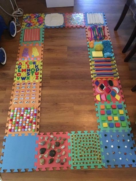 DIY sensory walk using foam puzzle tiles Sensory Walk, Diy Sensory, Sensory Wall, Sensory Bag, Rainbow Rice, Baby Sensory Play, Sensory Rooms, Toddler Sensory, Sensory Boards