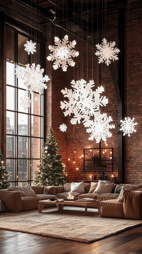 Modern loft decorated for Christmas with snowflakes, trees, lights, and a plush sofa, creating a cozy holiday atmosphere. Cutout Snowflakes, Cozy Christmas Bedroom Aesthetic, Indoor Christmas Decor Ideas, Christmas Tree Cozy, Festive Living Room, Cozy Candlelight, Living Room Christmas Decor Ideas, Indoor Christmas Decor, Room Christmas Decor Ideas