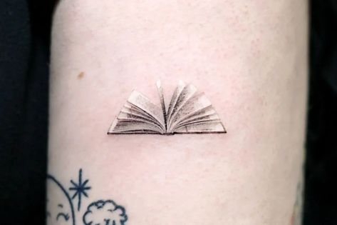 Book Ankle Tattoo, Tiny Book Tattoo Minimalist, Book Tattoo Fine Line, Places For Small Tattoos On Women, Book Tatoos Woman, Small Book Tattoos For Women, Literature Tattoos Minimalist, Small Bookish Tattoos, Book Tattoos For Women