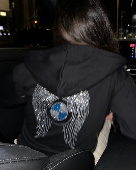 Bimmer Angel @g20anna 🪽 wearing our Iconic Black BMW Angel Hoodie.🖤 Our new website is live!🥳 Go check it out at bimmerangels.com #bimmerangels #bmw #bmwlove Angel Hoodie, Black Bmw, Bmw Black, Bmw Girl, Motorcycle Aesthetic, Black Angel, Black Angels, Wings Design, Rich Lifestyle