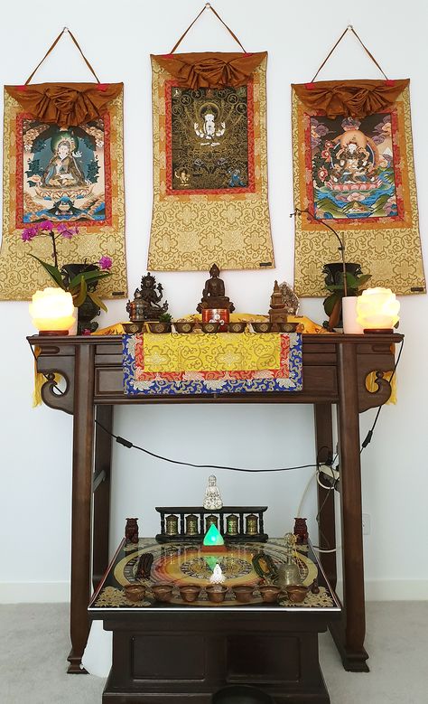 Buddhist altar with statues and thangka paintings Tibetan Buddhist Altar, Buddhist Monastery Interior, Buddhist Altar Design, Buddhist Altar Home Ideas, Buddha Altar Ideas, Buddhist Altar Home, Japanese Meditation Room, Spiritual Altar Ideas, Shrine Ideas