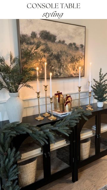 Melissa Coryell on Instagram: "*Comment “Details” and I’ll send a link straight to your DM’s of my console table and decor I’ve restyled my mantle 3 times and this console 3 times now as well. I can’t help it 😊 I love Christmas! And I love the new addition of these beautiful traditional gold candlestick holders (gifted) #sziqiqi Do you have the same problem restyling things over and over until it’s just right? “The Spirit himself bears witness with our spirit that we are children of God, and if children, then heirs—heirs of God and fellow heirs with Christ” Romans‬ ‭8‬:‭16‬-‭17‬ ‭ - Follow me on the LTK app to shop my feed - Follow @interiors.bymel for more neutral, cozy, traditional home decor inspo and affordable finds! @sziqiqi_official #amazonhome #amazonfinds #kirklands #kirkland Candlesticks On Mantle, Christmas Decor Console Table, Console Table Christmas Decor, Christmas Console Table Decor, Christmas Console Table, Cozy Traditional Home, Gold Candlestick Holders, Traditional Home Decor, Console Table Decorating