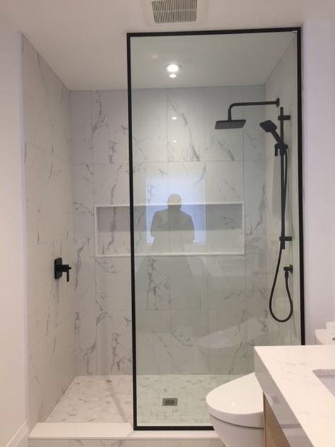 Contemporary Shower Design, Black Shower Doors Frame, Condo Shower Ideas, Shower Glass With Black Frame, Black Framed Shower Glass Panel, Single Glass Panel Shower Door, Single Shower Panel, Glass Shower With Black Frame, Black Bathroom Shower Door