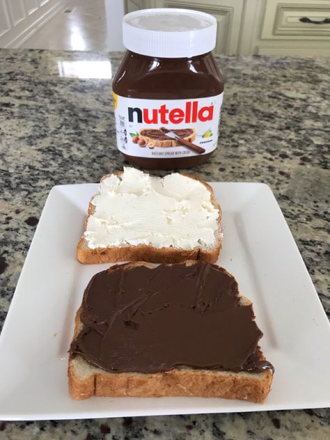 Nutella and cream cheese sandwich on sliced bread. Both ingredients smothered on frozen bread and baked in toaster oven at 350F (175C) for 1 minute. Cream Cheese Sandwiches, Toaster Oven, White Bread, Nutella, Cream Cheese, Oven, Sandwiches, Frozen, Snack Recipes