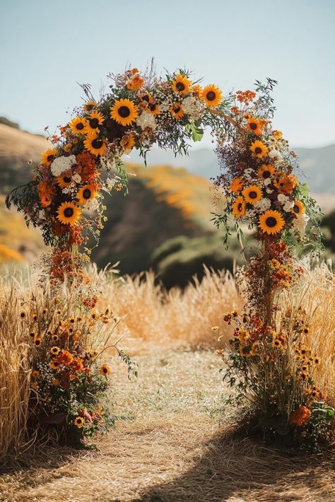 29 Boho Wedding Arch Ideas to Create a Dreamy Backdrop 17 Boho Wedding Sunflowers, 2024 Wedding Arch Trends, Sunflower Wedding Arch Rustic, Wedding Arch Ideas Rustic, Rustic Sunflower Wedding Ideas, Sunflower Wedding Theme Rustic, Boho Sunflower Wedding, Wedding In Field, Sunflower Field Wedding