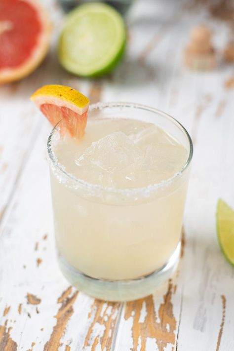 My grapefruit margaritas are made with blanco tequila, freshly squeezed grapefruit juice, fresh lime juice, simple syrup, and elderflower liquor. They’re real, simple, and offer a refreshing twist on the classic marg. A lot of critics may think a grapefruit-based cocktail is bitter. Well, you're right, however, paired with simple syrup and elderflower, that bitterness fades into the irresistible flavor. #grapefruitmargarita #margaritarecipe #cocktail #grapefruitcocktail Elderflower Liquor, Grapefruit Margarita Recipe, Mexico Holiday, Lime Squeezer, Grapefruit Cocktail, Spicy Drinks, Paloma Cocktail, Spicy Cocktail, How To Make Margaritas