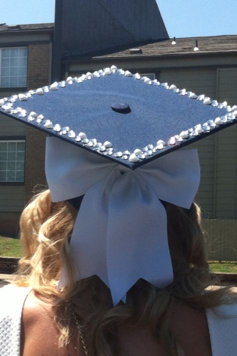 Graduation cap! Bow Cap Graduation, Simple Cap Ideas For Graduation, Grad Caps With Bows, Hat Graduation Decoration, Pink Rhinestone Grad Cap, Extra Graduation Cap, College Grad Cap Ideas Simple, Graduation Hair Ideas With Cap, Grad Hats Ideas