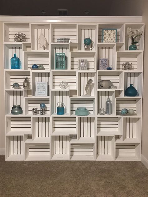 Crate Wall. Bookshelf Wall. Blue and Silver Bookshelf Decor. Crate Bookshelf On Wall, Diy Store Display Wall Shelves, Wood Crate Wall, Crate Wall Display, Crates Bookshelf, Vintage Crate Bookshelf, Diy Wall Display Shelves, Crate Wall Shelves, Wall Mounted Shelves Bedroom