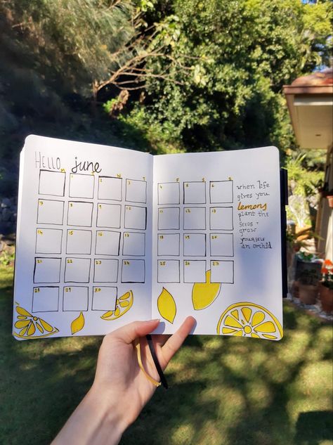 Hand holding bullet journal which is open to month of June and has lemon theme Bullet Journal Ideas June, June Bullet Journal Ideas Layout, Lemon Bullet Journal Theme, June Days, Journal June, June Monthly Spread Bullet Journal, June Bullet Journal Weekly Spread, June Calendar, Lemon Plant