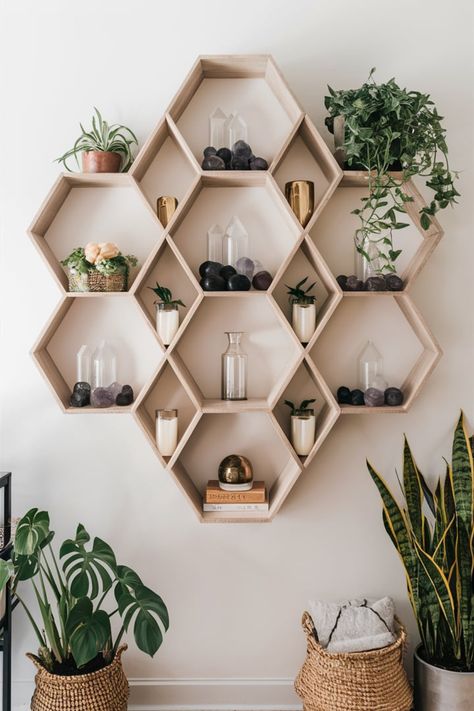 Transform your space with geometric shelving designs like hexagons or mandalas. Fill each compartment with plants, crystals, or candles to create a modern, spiritual aesthetic perfect for boho-inspired decor. #GeometricShelving #BohoDecor #ModernBohoVibes #SpiritualHome #HexagonalShelves #MandalaDesign #DecorWithMeaning #GreeneryAndCrystals #HomeStylingInspo #BohoLivingSpace Hexagon Plant Wall, Boho Shelving, Geometric Shelving, Boho Shelves, Plants Crystals, Spiritual Aesthetic, Geometric Shelves, Shelving Design, Macrame Hanging