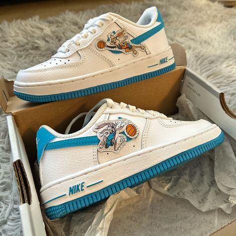 Nike Space Jam X Air Force 1s ‘07 Low ‘Hare. Size 11c In Kids Size. White And Blue With Bugs Bunny Logos On The Outer Side Ends. Neutral Shoes For Both Boys And Girls. Air Force 1s, Neutral Shoes, Bunny Logo, Space Jam, Blue Nike, Bugs Bunny, Dream Shoes, Kids Nike, Shoes Nike