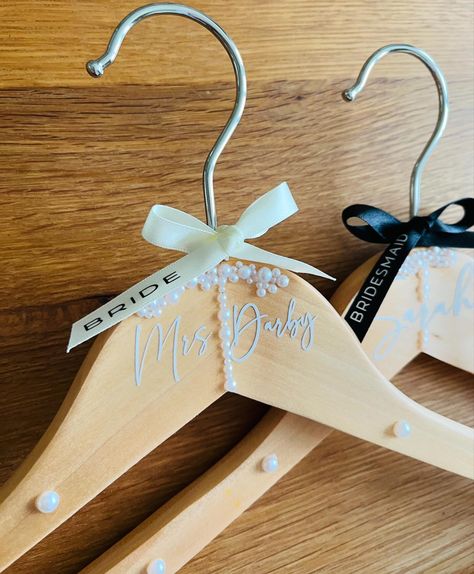 Bridal Wooden hangers - with pearl detail - Available now 🖤🤍 #bridesmaidgift #bridesmaidproposal #bridehanger #wedding #bridetobe #instabride #instagrambride Bride Hanger, Wooden Hangers, Bridesmaid Gifts, Hangers