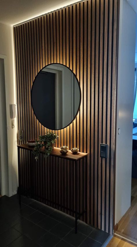 Wood Panels Entryway, Mirror Slat Wall, Mirror On Wooden Panel, Entryway Wood Paneling, Slat Wall With Mirror, Mirror Panel Wall Interior Design, Wood Panel Entryway, Slat Wall Hallway, Quirky Hallway