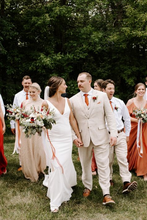 This groom was styled in one of our top-selling tie and suspenders sets: Bronze Silk Rust Orange Silk Tie and skinny cognac suspenders. A beautiful, outdoor, summer wedding with a pop of color. #grooms #groom #groomsmen #summerwedding #wedding #weddingideas #weddinginspo #bowtie #tie #suspenders #fallwedding Tan Suit Orange Tie, Sunset Wedding Colors Groomsmen, Orange Groomsmen, Floral Tie Groom, Groom In Jeans, Sunset Wedding Colors, Tan Suit Wedding, Oasis Wedding, Sunrise Wedding