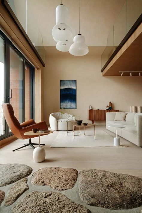 With yellowy undertones, sand has a natural warmth to it, as seen painted on the walls of this beautiful, compact apartment in Poland. Instead of a bright yellow living room, the sand tone is subdued and muted, but still brings a golden glow to the space, even during the colder Polish winter months. Apartment With A View, Warm Living Room Colors, Living Colors, Modern Rustic Living Room, Living Room Warm, Beige Living Rooms, Pink Living Room, 1000 Years, Living Room Trends