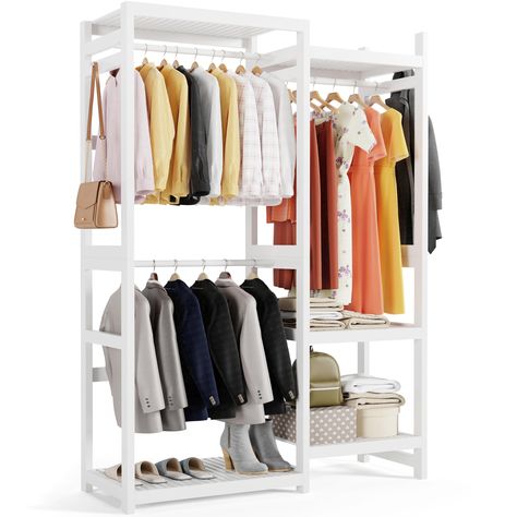 PRICES MAY VARY. 【Premium Bamboo Construction】Crafted from durable bamboo, covered with polished white paint, this garment rack is designed to blend seamlessly with any décor and easy to clean with a simple damp cloth. The robust bamboo frame supports up to 500 lbs, ensuring reliability and stability for years to come. 【Versatile Closet Storage】Equipped with 2 short hanging sections, 1 long hanging section, and 5 adjustable open shelves, this garment rack offers ample storage for clothes, luggage, bedding, shoes, and accessories. Includes 2 addtional wooden hanging pegs for hats, towels, and bags, perfect for optimizing wardrobe storage in any room. DIY your wardrobe if you have substantial clothes-hanging demand. 【Space-Saving Wardrobe Design】With dimensions of 77” H x 47.2” W x 16.3” D, White Clothing Rack, Freestanding Closet, Bamboo Clothes, Storage Solutions Closet, Free Standing Closet, White Closet, Closet Rods, Clothes Racks, Bamboo Construction