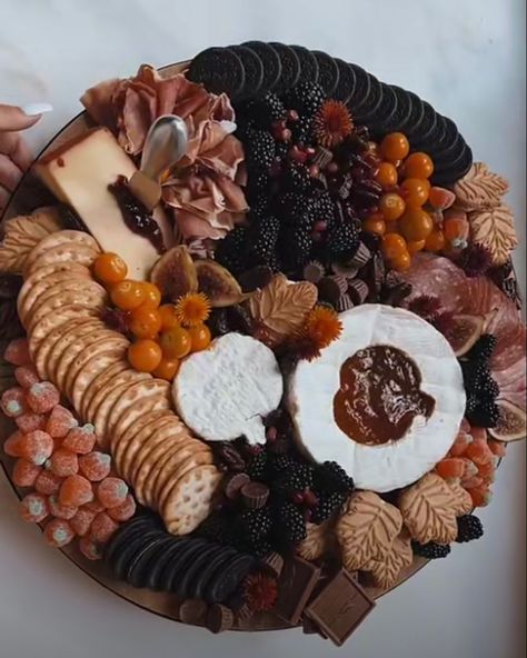 Autumn Fruit Tray, Pink And Black Charcuterie Board, Disney Halloween Charcuterie Board, Red And Black Charcuterie Board, Brown Food Board Ideas, Wednesday Addams Charcuterie, Brown Charcuterie Board Ideas, Twilight Charcuterie Board, Black Charcuterie Board Ideas