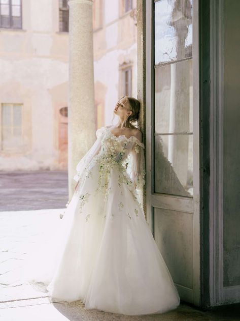 To celebrate 25 years in the wedding business, Monique Lhuillier's Spring 2022 Bridal Collection plays off of past signature looks, integrating the floral details and luxurious fabrics that Monique’s work is so well-known for. Shot at a historic villa in Lake Como, Italy, KT Merry captures the feminine bridal looks that have become synonymous with Monique Lhuillier's gowns. See them all on the KT Merry Journal here. #moniquelhuillier #moniquelhuillierbridal #lakecomowedding #lakecomovilla Floral Wedding Dresses, Monique Lhuillier Wedding, Monique Lhuillier Wedding Dress, Monique Lhuillier Bridal, Bridal Business, Fairy Wedding, Floral Wedding Dress, A Wedding Dress, Monique Lhuillier