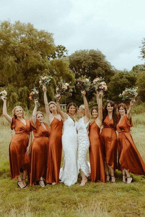 Brides in a variety of burnt orange bridesmaid dresses with two brides in white classic wedding dresses Burnt Orange Wedding Colors, Burnt Orange And Sage Green, Orange And Sage Green, Orange Wedding Color Palette, Orange Bridesmaids, Burnt Orange Bridesmaid, Orange Wedding Themes, Burnt Orange Bridesmaid Dresses, Burnt Orange Wedding