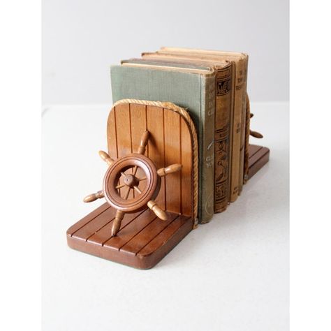 Sail the high seas, without ever leaving your bookshelf! These vintage ship wheel bookends will add a splash of fun and nautical charm to your library. Crafted with wood frames and rope trim, these stylish bookends come complete with convenient felt bases, perfect for keeping your books afloat. Ahoy, matey! Nautical Vintage Decor, Vintage Nautical Aesthetic, Sailboat Nursery Baby Boy, Vintage Nautical Nursery, Vintage Lake House Decor, Beach Baby Rooms, Ocean Baby Rooms, Sailor Room, Boat Nursery