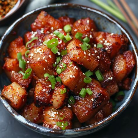 🔥 Spice up your meal with Jeyuk Bokkeum! 🌶️ #JeyukBokkeum #SpicyPork Jeyuk Bokkeum (Spicy Pork Belly) Ingredients: Pork belly (500g, sliced) Gochujang (Korean chili paste) (2 tbsp) Soy sauce (2 tbsp) Sugar (1 tbsp) Garlic (3 cloves, minced) Ginger (1 tsp, minced) Sesame oil (1 tbsp) Onion (1, sliced) Carrot (1, julienned) Green onions (2, chopped) Sesame seeds (1 tbsp) Instructions: Marinate pork belly with gochujang, soy sauce, sugar, garlic, ginger, and sesame oil for 30 minutes. Heat a... Gochujang Pork Belly, Chinese Pork Belly Recipes Soy Sauce, Honey Gochujang Chicken, Gochujang Tofu, Crispy Gochujang Tofu, Korean Chili Paste, Twisted Recipes, Marinated Pork, Spicy Pork