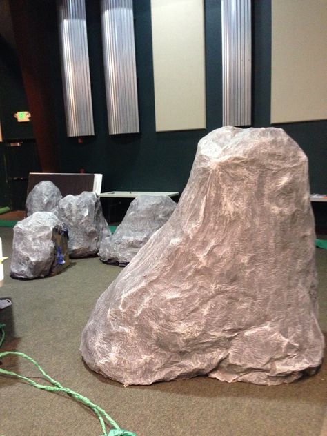 Fake rocks made out of a cardboard box covered with bushels of butcher paper. Then paper mâchéd Cardboard Bushes Prop, Fake Rocks Diy, Halloween Cave, How To Make Fake Rocks With Paper, Fake Rocks Diy Paper, Diy Rock Stage Prop, Cave Diorama Boxes, Arctic Vbs, Monumental Vbs