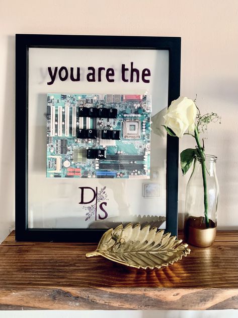 Are you looking for a cute, aesthetic gift to make for the techie nerd in your life? Look no further! I used keys from an old keyboard to spell out a message. To color up the frame, I printed a picture of a motherboard/CPU to serve as a background to the keys. Superglue works best:) #keyboard #tech #gift #valentines #couplegoals Valentines Husband, Diy Tech, Aesthetic Gift, Tech Gift, Cute Aesthetic, Tech Gifts, 3 Things, Motherboard, Cyberpunk