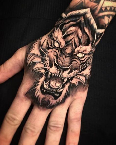 15+ Best Tiger Head Tattoo Designs and Ideas | PetPress Tiger Hand Tattoo, Japanese Hand Tattoos, Lion Hand Tattoo, Tiger Face Tattoo, Tiger Head Tattoo, Herren Hand Tattoos, Tiger Tattoo Design, Palm Tattoos, Head Tattoo