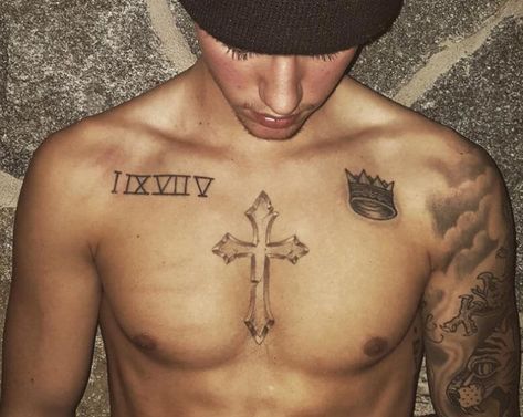 List of All Justin Bieber Tattoos With Meaning (2019) Justin Bieber Arm Tattoo, Chest Tattoo Roman Numerals, Chest Tattoo With Meaning, Arm Tattoos With Meaning, Justin Tattoo, Tiny Cross Tattoo, Christus Tattoo, Cross Tattoo Meaning, Justin Bieber Tattoos