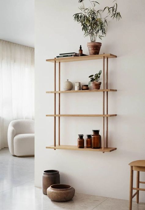 Fogia's minimalist and very versatile 'Bond' oak shelving unit, shown in a minimalist living room in white and neutral earth tones | 21 of the best wall-mounted shelving units | These Four Walls blog Fogia Bond, Plants Shelves, Diy Shelves Design, Minimalist Shelves Decor, Oak Shelving Unit, Wall Mounted Shelving Unit, Minimalist Shelves, Wall Display Shelves, Shelving Design