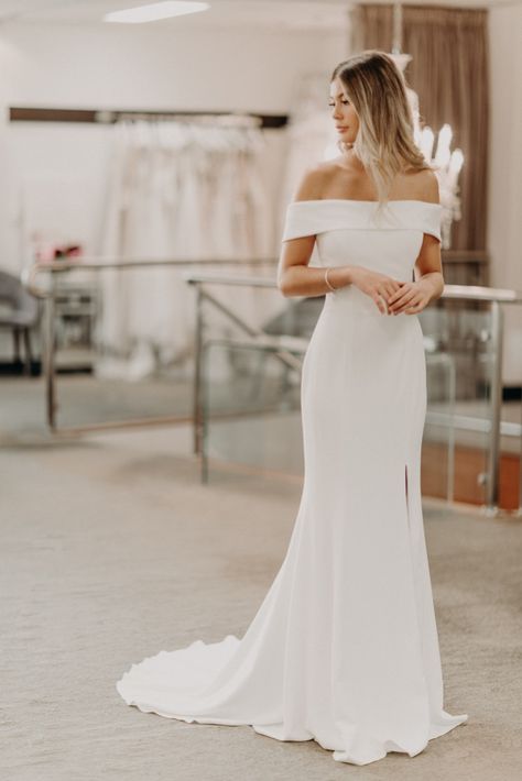 Francine will soon be arriving at the Yes Bridal Studio in Matlock, Derbyshire.  She is an elegant stylish dress with the beautiful v back and Bardot neckline / off the shoulder, available to try on from September 2020, why not book your appointment now?! Wedding Gowns Simple Elegant, Fit And Flare Simple Wedding Dress, Simple Wedding Dress With Buttons, Bardot Neckline Wedding Dress, Crepe Off The Shoulder Wedding Dress, Crepe Wedding Dresses, Clean And Simple Wedding Dress, Straight Across Wedding Dress, Classy Wedding Dress Sophisticated Bride