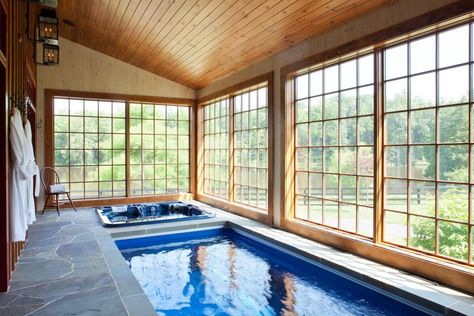 Large pane windows offer natural light and commanding views from this peaceful spa/pool retreat which was designed by Rill Architects and makes a welcome extension of the adjoining house. Small Indoor Pool, Indoor Pool House, Indoor Swimming Pool Design, Pool Indoor, Indoor Hot Tub, Indoor Pool Design, Sun Rooms, Endless Pool, Piscina Interior