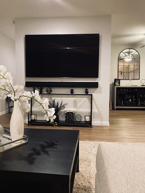 Narrow Tv Console Mounted Tv, Console Table With Baskets Under Tv, Tv With Sound Bar On Wall Living Room, Narrow Console Table Under Tv, Under Tv Console Table Decorating, Mounted Tv With Console Table, Sofa Table Under Tv, Mounted Tv And Console Table, Soundbar Ideas Living Rooms