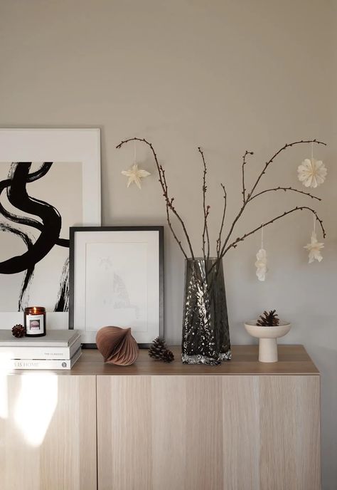 Festive sideboard display with Scandinavian paper stars, bare branches and pine cones | Minimalist Christmas decorations in neutral, nature-inspired colours | These Four Walls blog Sideboard Decor, Finish Work, Office Christmas Decorations, Christmas Living Rooms, Minimalist Christmas, Star Decorations, Christmas Mood, Decorative Panels, Wall And Floor Tiles